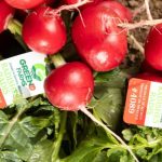 QR code on a Green Life Farms produce carton for digital traceability and field-to-fork transparency.